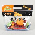 Plastic orange fruit bag with vent holes and carry handle
