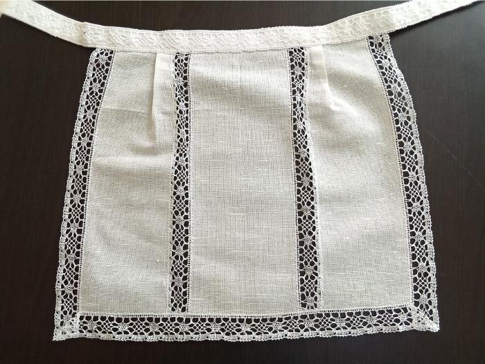 Apron from bleached  linen with transparent lace