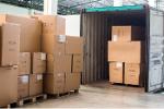 Unloading containers and placing on pallets