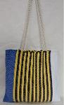 Handwoven handbag made from cotton cord with rope handles.