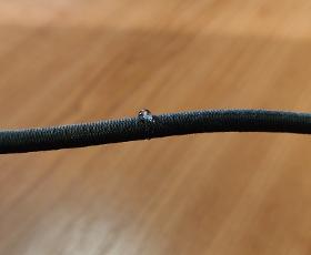 Elastic cord with hydrophobic treatment