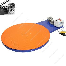 Rotating platform with foot pedal for wrapping